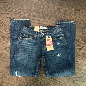 New, never worn boys Levi 502 regular taper leg size 8 jeans.